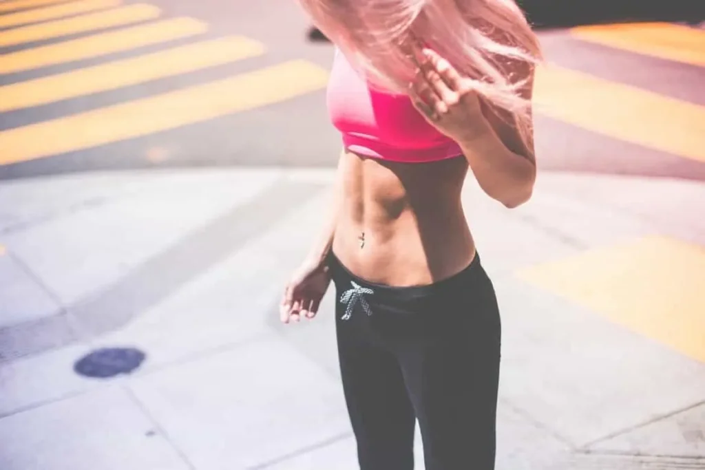 Woman with toned stomach after LA-EMS Body Sculpting Treatment Moss Side